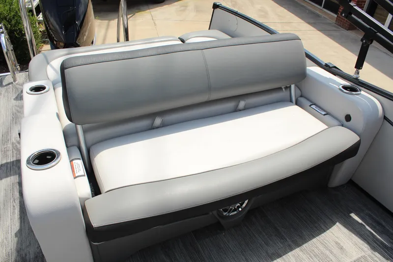 Slide: The Image of 2023 Tahoe Pontoon Cascade Platinum Versatile Rear Bench, gray seating with cup holders. - 11