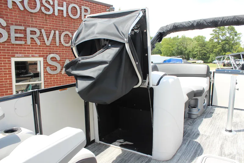 Slide: The Image of 2023 Tahoe Pontoon Cascade Platinum Versatile Rear Bench 23' interior with seating and storage. - 19