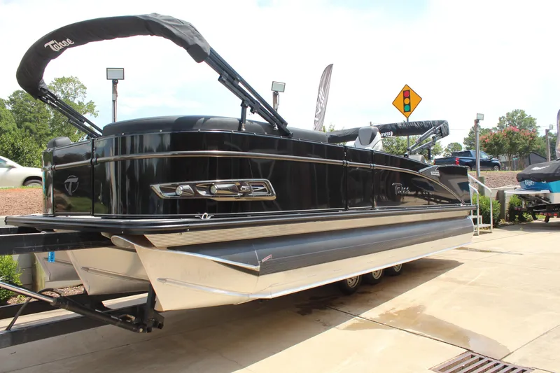 Slide: The Image of 2023 Tahoe Pontoon Cascade Platinum Versatile Rear Bench 23' on display outdoors. - 5