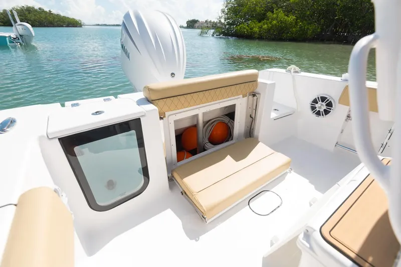 Slide: The Image of 2026 Sportsman Open 232 Center Console boat interior with engine view. - 16