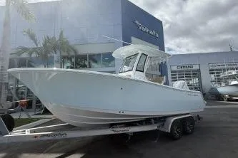 Slide: The Image of 2026 Sportsman Open 232 Center Console boat on trailer outside dealership. - 20