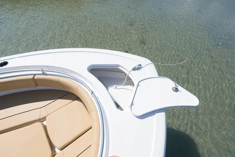 Slide: The Image of 2026 Sportsman Open 232 Center Console boat interior with tan seating and modern design. - 3
