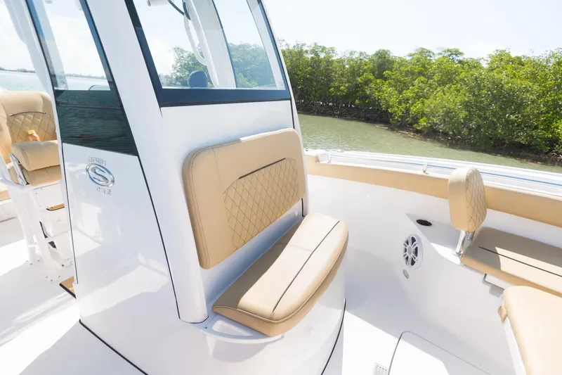 Slide: The Image of 2026 Sportsman Open 232 Center Console boat interior with modern seating and controls. - 7