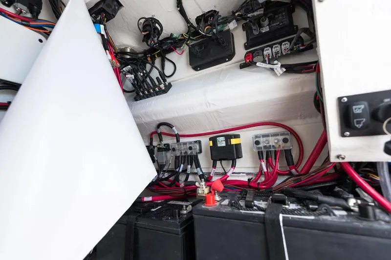 Slide: The Image of 2026 Sportsman Open 232 Center Console boat interior in showroom with modern features. - 9