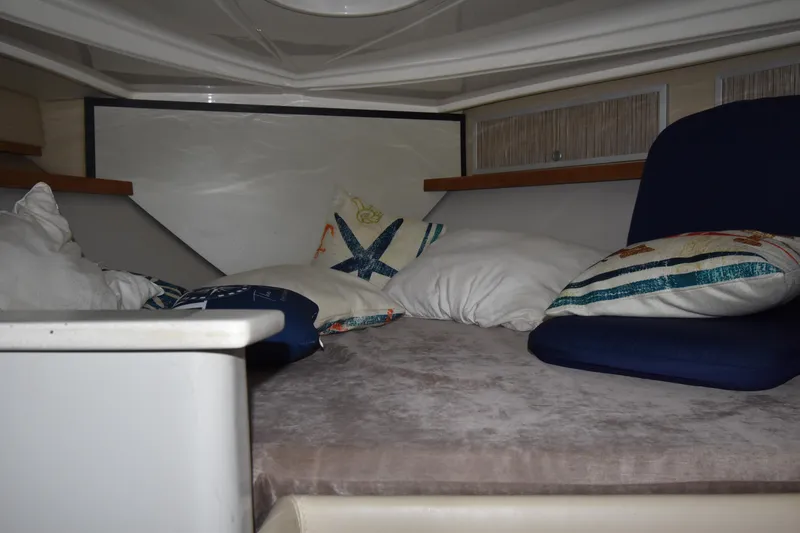 Slide: The Image of 2018 Pronautica 34 cabin interior with cozy bedding and cushions. - 15