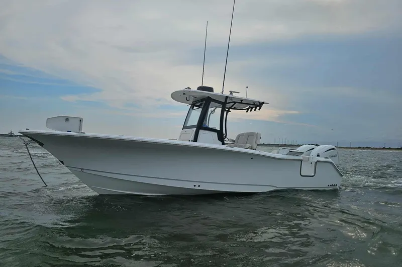 The Image of 2024 Sea Hunt Gamefish 27 Coffin Box boat on water, side view. - 0