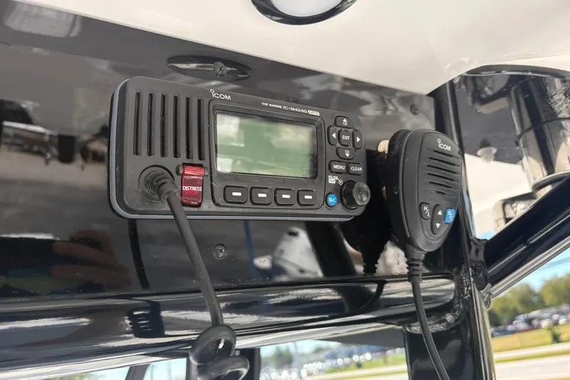 Slide: The Image of ICOM VHF marine radio on 2024 Sea Hunt Gamefish 27 Coffin Box boat dashboard. - 16