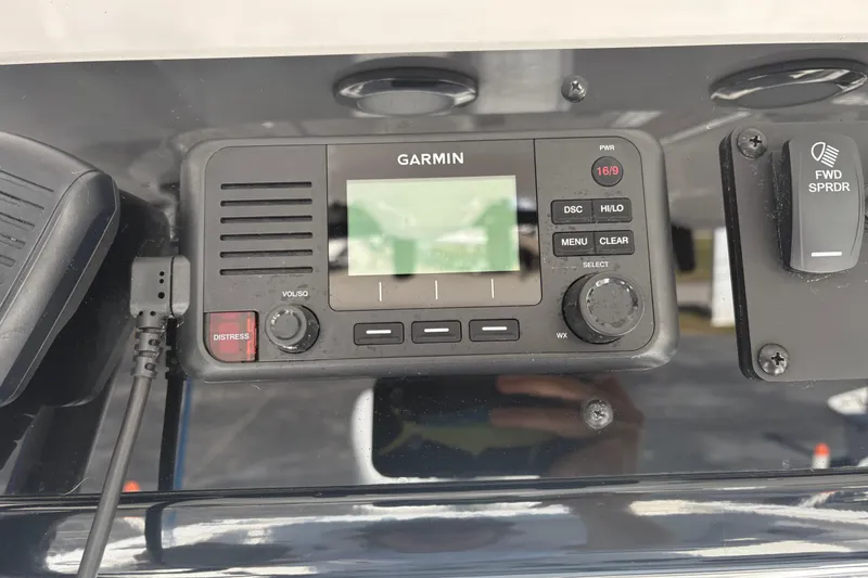 Slide: The Image of Garmin marine radio on 2024 Sea Hunt Gamefish 27 Coffin Box dashboard. - 17