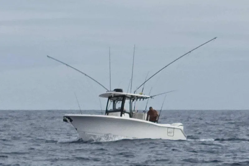 Slide: The Image of 2024 Sea Hunt Gamefish 27 Coffin Box boat navigating ocean waters. - 2