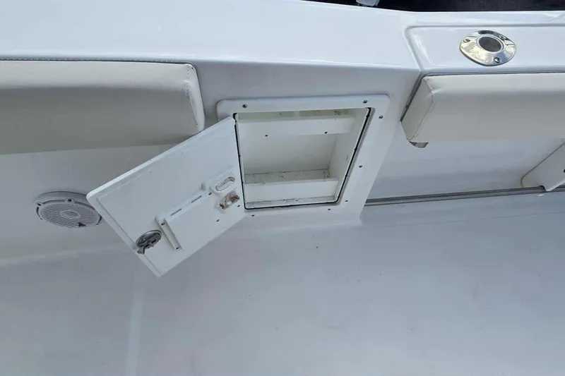 Slide: The Image of 2024 Sea Hunt Gamefish 27 Coffin Box, open storage compartment on deck. - 23