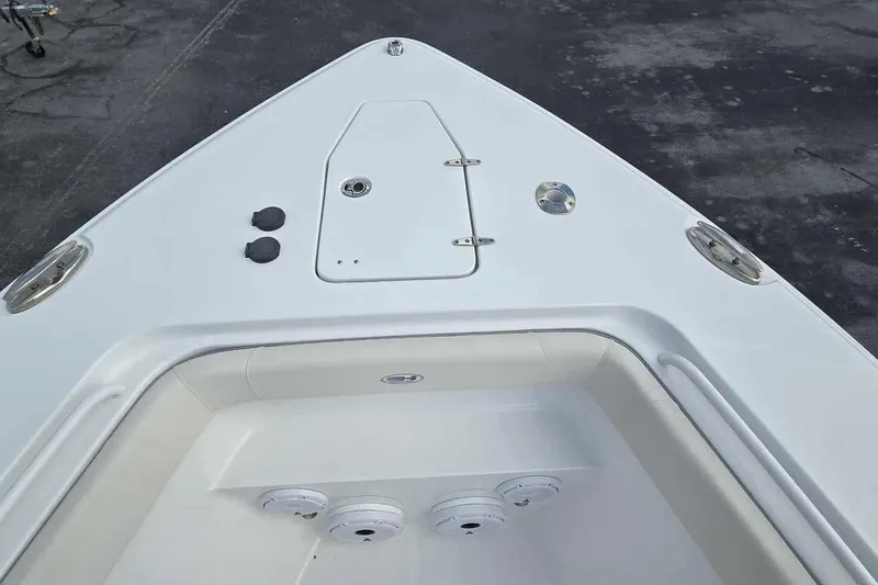 Slide: The Image of 2024 Sea Hunt Gamefish 27 Coffin Box boat deck, featuring storage compartments. - 8