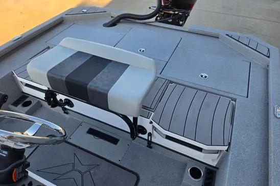 Slide: The Image of 2026 Vexus ACX2150 boat interior with gray seating and storage compartments. - 10