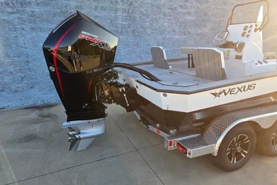 Slide: The Image of 2026 Vexus ACX2150 boat with Mercury Pro XS engine, parked on a trailer. - 11