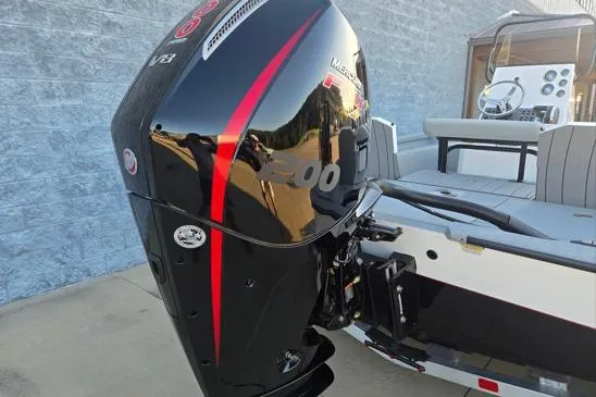 Slide: The Image of 2026 Vexus ACX2150 boat with powerful Mercury outboard engine, docked outdoors. - 12