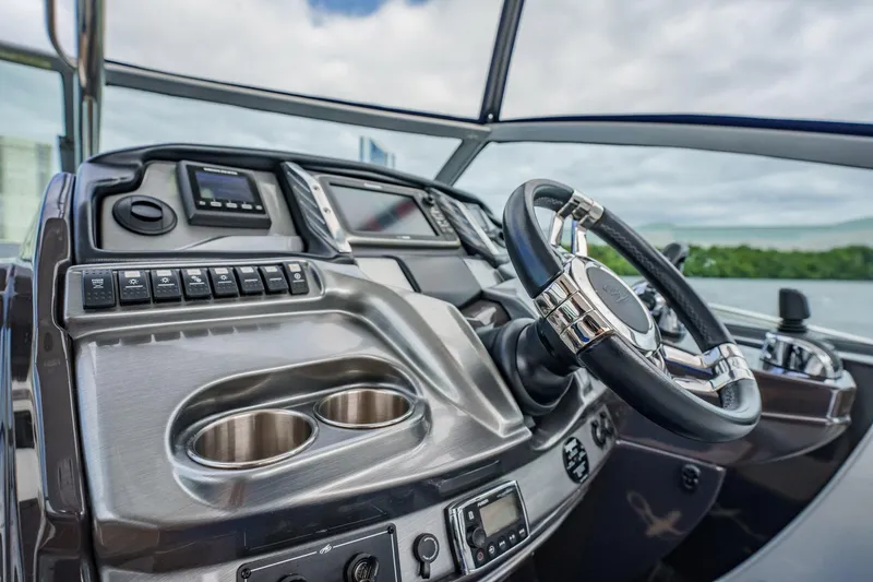 Slide: The Image of Cockpit of 2015 Monterey 335 Sport Yacht with modern controls and steering wheel. - 30