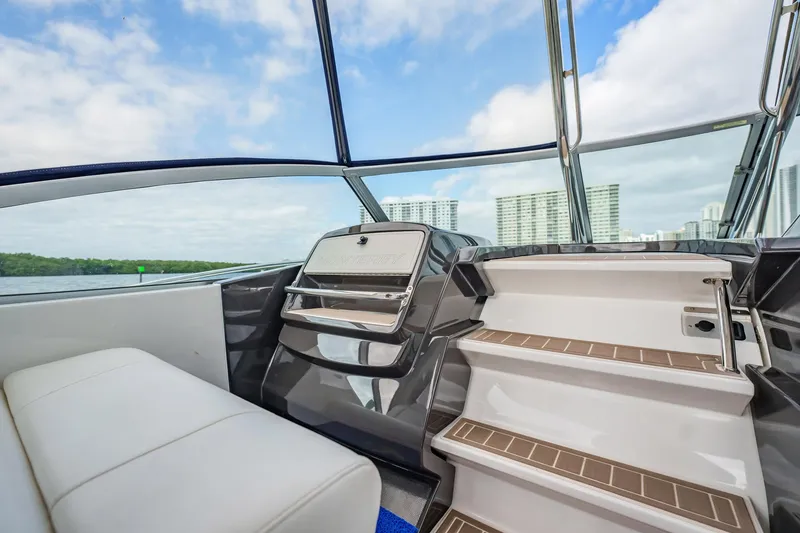 Slide: The Image of 2015 Monterey 335 Sport Yacht interior with sleek seating and modern design. - 31