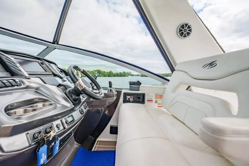 Slide: The Image of 2015 Monterey 335 Sport Yacht interior with modern dashboard and plush seating. - 38