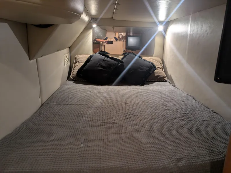 Slide: The Image of Cozy sleeping quarters in a 2008 Chaparral 330 Signature boat. - 10
