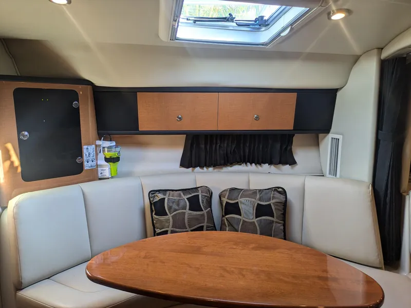Slide: The Image of Interior of 2008 Chaparral 330 Signature boat with dining area and skylight. - 14