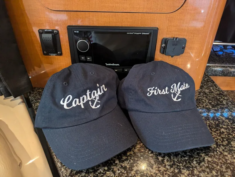 Slide: The Image of Navy blue Captain and First Mate hats on Chaparral 330 Signature boat, 2008 model. - 17