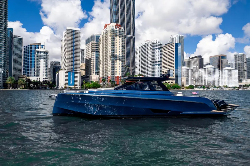 Slide: The Image of Luxury Dutch American DA 53 yacht cruising near city skyline, 2025 model. - 0