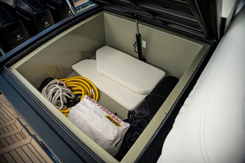 Slide: The Image of Storage compartment of 2025 Dutch American DA 53 boat with safety gear and ropes. - 25