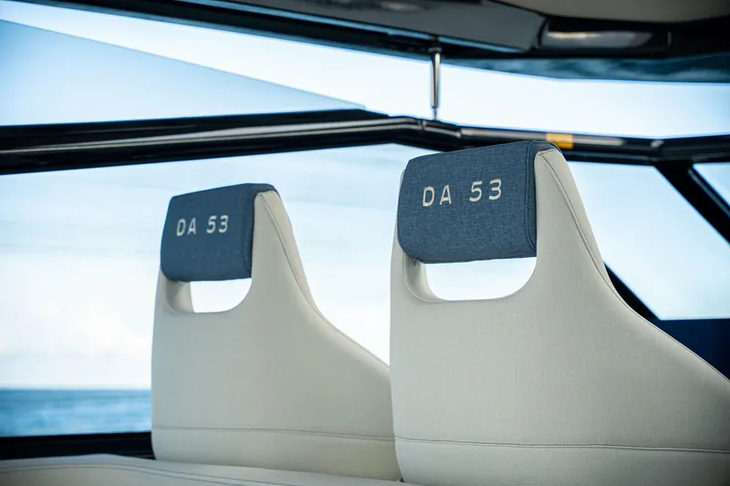 Slide: The Image of Luxury seating in 2025 Dutch American DA 53 boat, featuring sleek design and ocean view. - 31