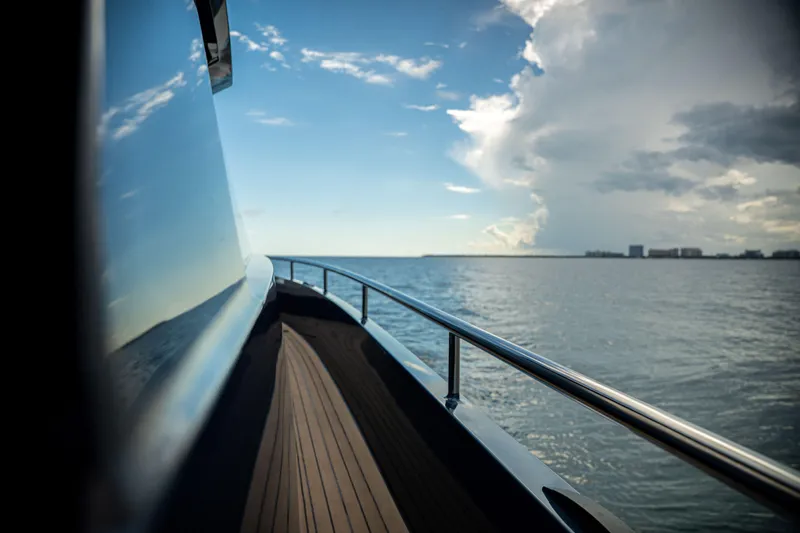 Slide: The Image of Side view of Dutch American DA 53 yacht cruising on open water, 2025 model. - 36