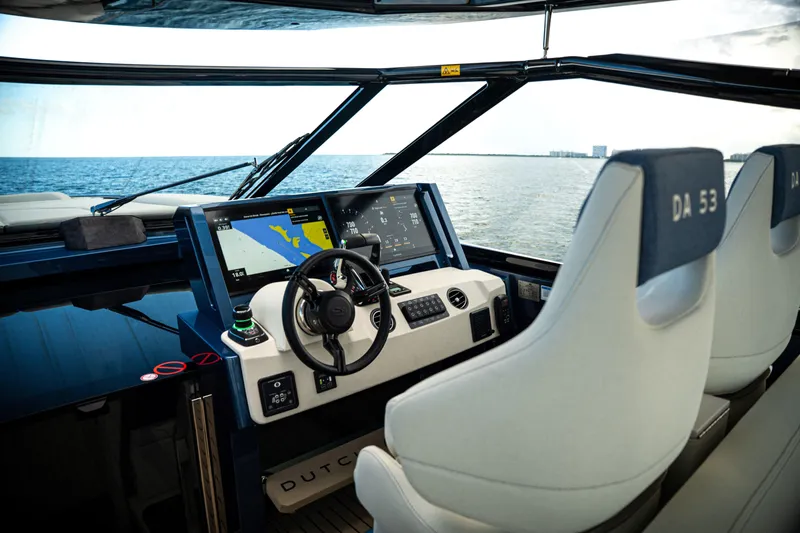 Slide: The Image of Cockpit of 2025 Dutch American DA 53 yacht with navigation screens and steering wheel. - 47
