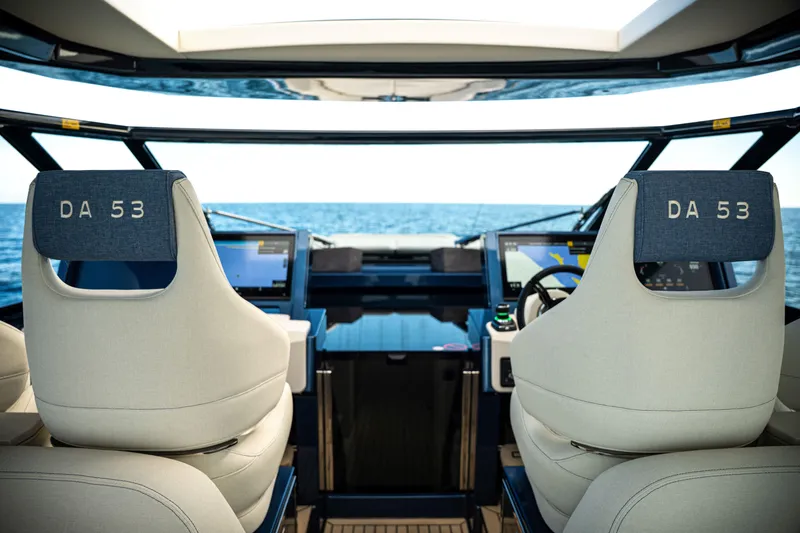 Slide: The Image of Interior view of 2025 Dutch American DA 53 yacht cockpit with ocean backdrop. - 48