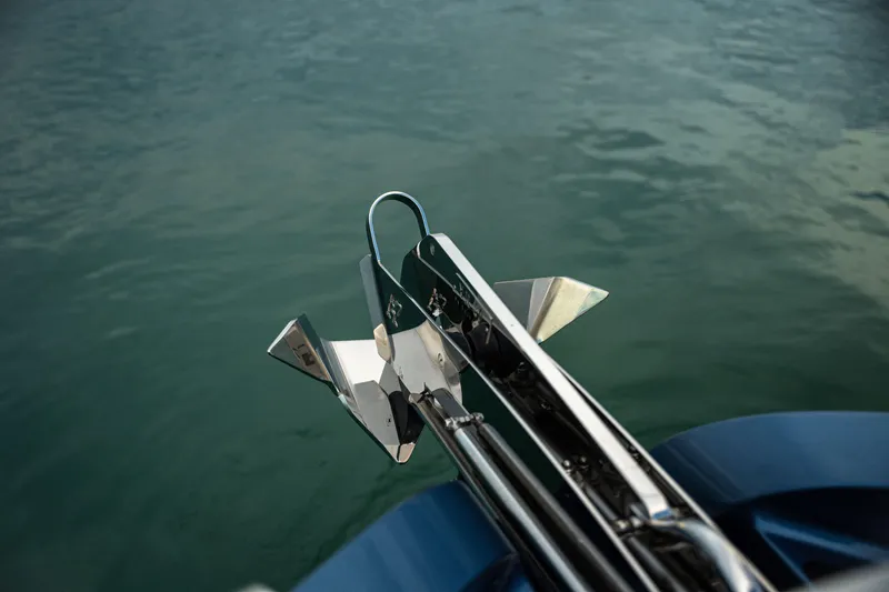 Slide: The Image of Anchor of Dutch American DA 53 boat, 2025 model, over calm water. - 62