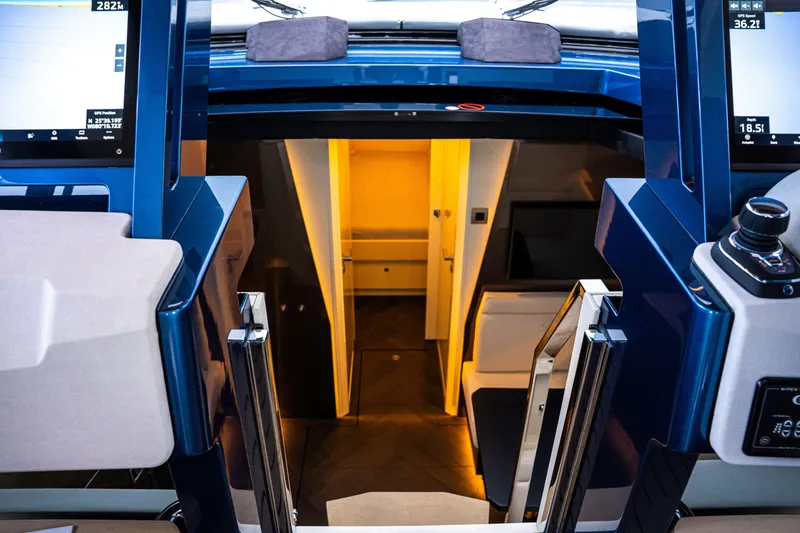 Slide: The Image of Interior view of 2025 Dutch American DA 53 yacht, featuring modern navigation controls and luxurious cabin. - 73