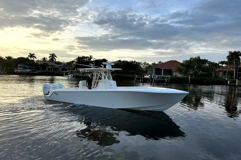 The Image of 2017 SeaVee 34Z boat cruising on calm waters at sunset. - 0