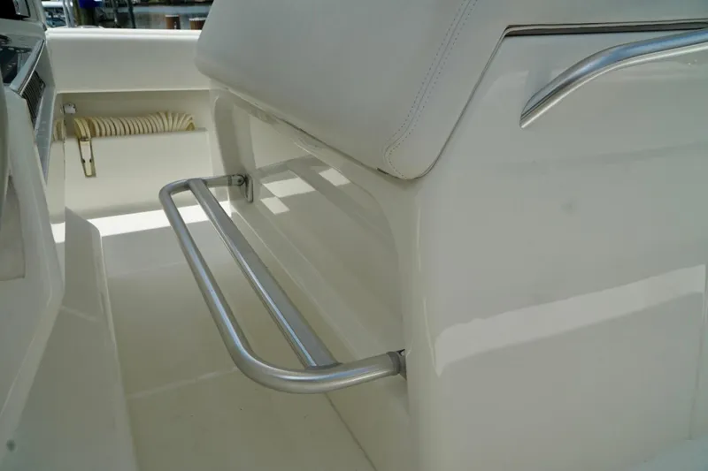 Slide: The Image of 2017 SeaVee 34Z boat interior with sleek metal footrest and white seating. - 103