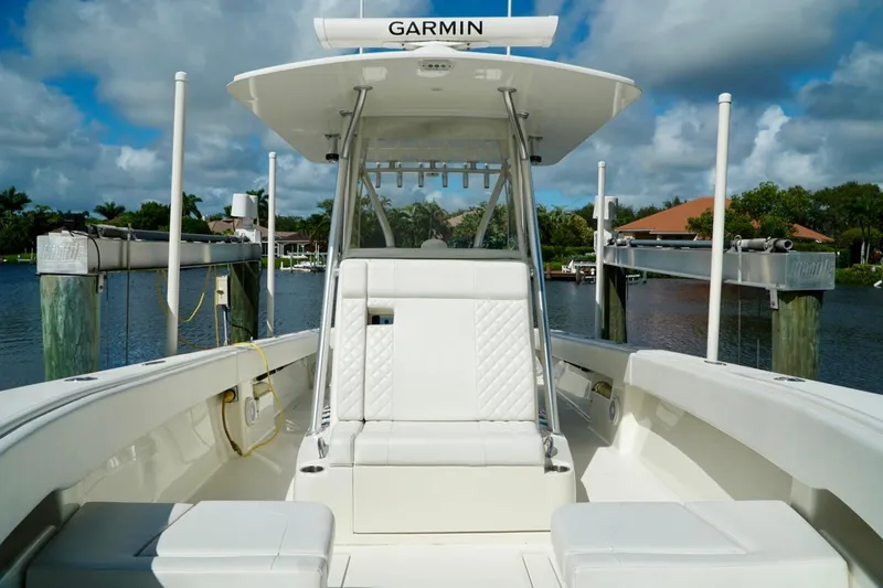 Slide: The Image of 2017 SeaVee 34Z boat with Garmin equipment, docked by a scenic waterfront. - 106