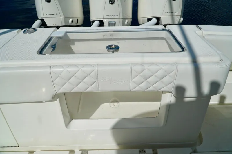 Slide: The Image of 2017 SeaVee 34Z boat with white upholstery and triple Verado engines. - 17
