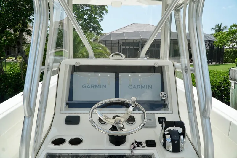 Slide: The Image of 2017 SeaVee 34Z boat dashboard with Garmin navigation system and steering wheel. - 27