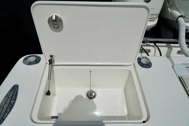 Slide: The Image of Open storage compartment on 2017 SeaVee 34Z boat deck. - 28