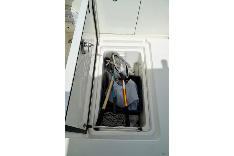 Slide: The Image of Storage compartment on 2017 SeaVee 34Z boat with fishing gear and equipment. - 30