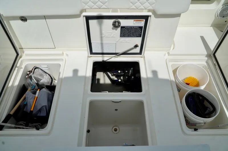 Slide: The Image of 2017 SeaVee 34Z boat storage compartments with fishing gear and equipment. - 33