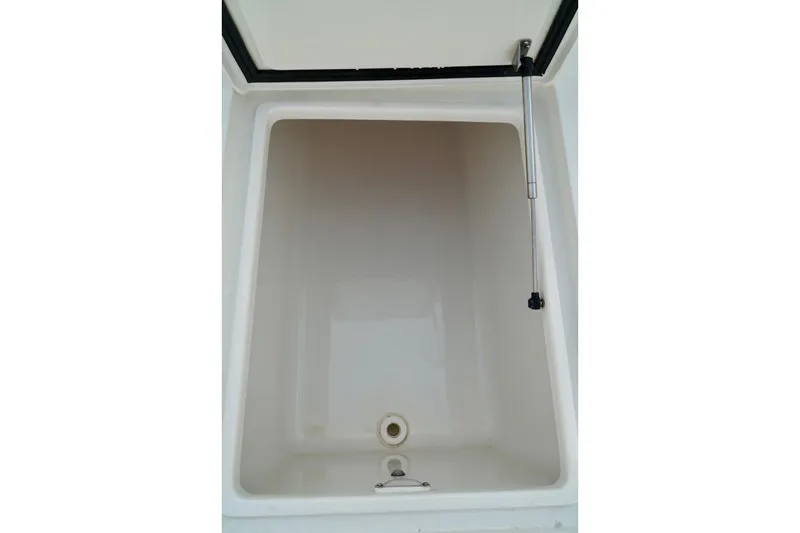 Slide: The Image of Storage compartment of 2017 SeaVee 34Z boat, featuring a hydraulic lift. - 34