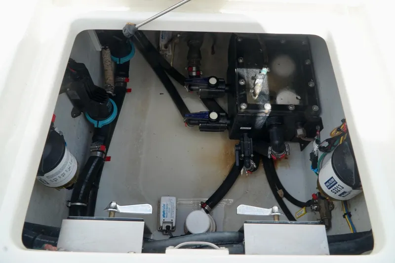 Slide: The Image of Engine compartment of a 2017 SeaVee 34Z boat, showing various mechanical components. - 35