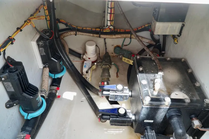 Slide: The Image of Engine compartment of a 2017 SeaVee 34Z boat, showcasing wiring and mechanical components. - 39