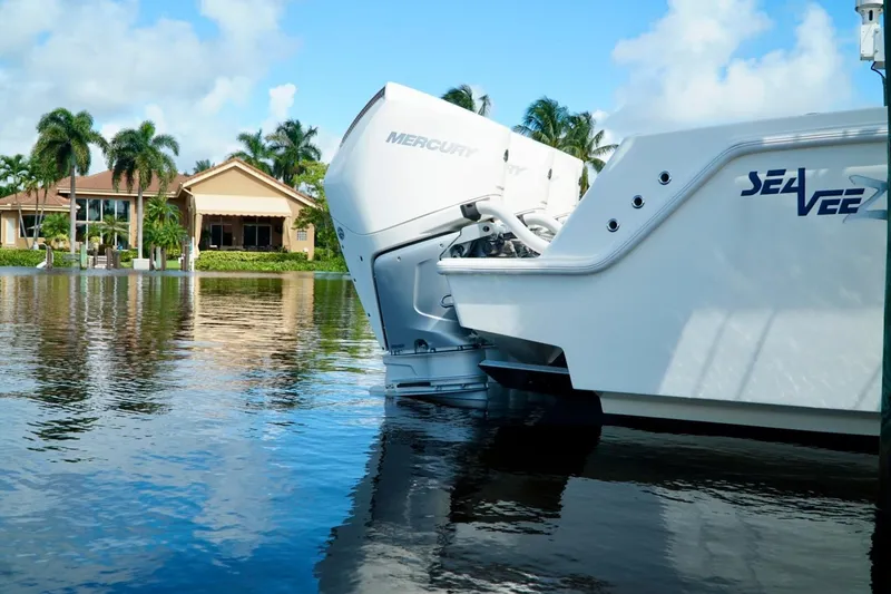 Slide: The Image of 2017 SeaVee 34Z boat with Mercury engines on a calm waterfront. - 4