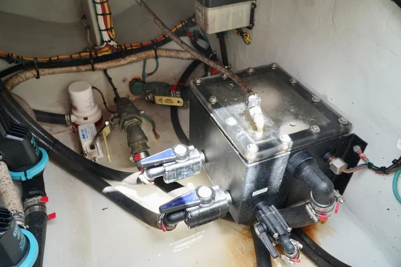 Slide: The Image of 2017 SeaVee 34Z boat engine compartment with wiring and plumbing components. - 42