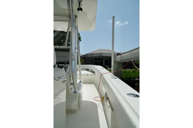Slide: The Image of 2017 SeaVee 34Z boat deck with railing and equipment under clear sky. - 43