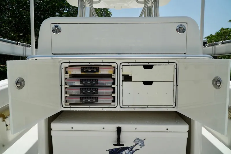 Slide: The Image of 2017 SeaVee 34Z boat storage compartments with tackle boxes and drawers open. - 45