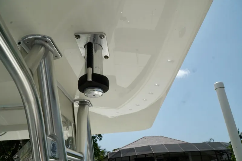 Slide: The Image of 2017 SeaVee 34Z boat detail with stainless steel fittings under clear blue sky. - 47