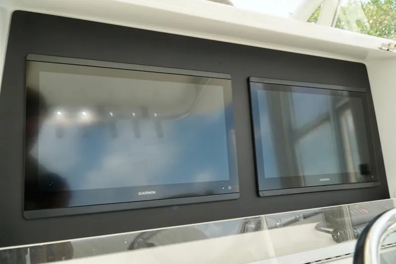 Slide: The Image of Dual Garmin displays on 2017 SeaVee 34Z boat dashboard. - 48