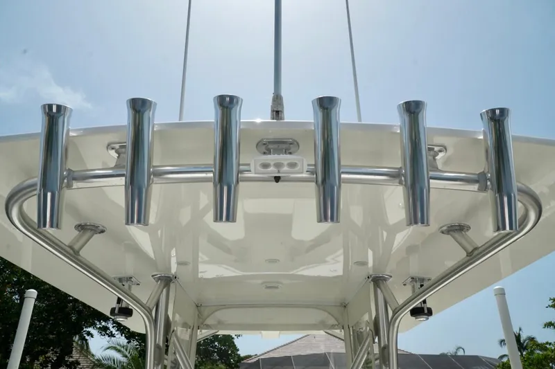 Slide: The Image of 2017 SeaVee 34Z boat with stainless steel rod holders under a clear blue sky. - 49